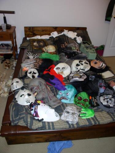 28-This is a bunch of Jeff's mask and stuff laid out on his bed.