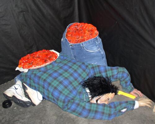 14-This is the person chopped in half with his intestines showing for the 2007 haunt.