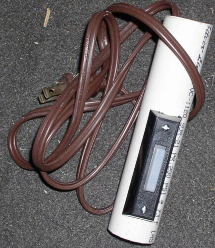 20-This is the trigger for the props. Made form a doorbell switch and a piece of pvc. This plugged into an extension cord that ran to the "Magic Box".